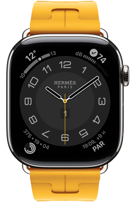 Apple Watch Hermes Series 11, cadran analogique Circulaire (aiguilles pour les heures, les minutes et les secondes, complications : météo, anneaux d’activité, heure de Paris, bruit), bo?tier en titane, argent, c?té droit, couronne Digital Crown, bracelet Kilim simple tour, jaune (jaune serin), en caoutchouc fluoroélastomère
