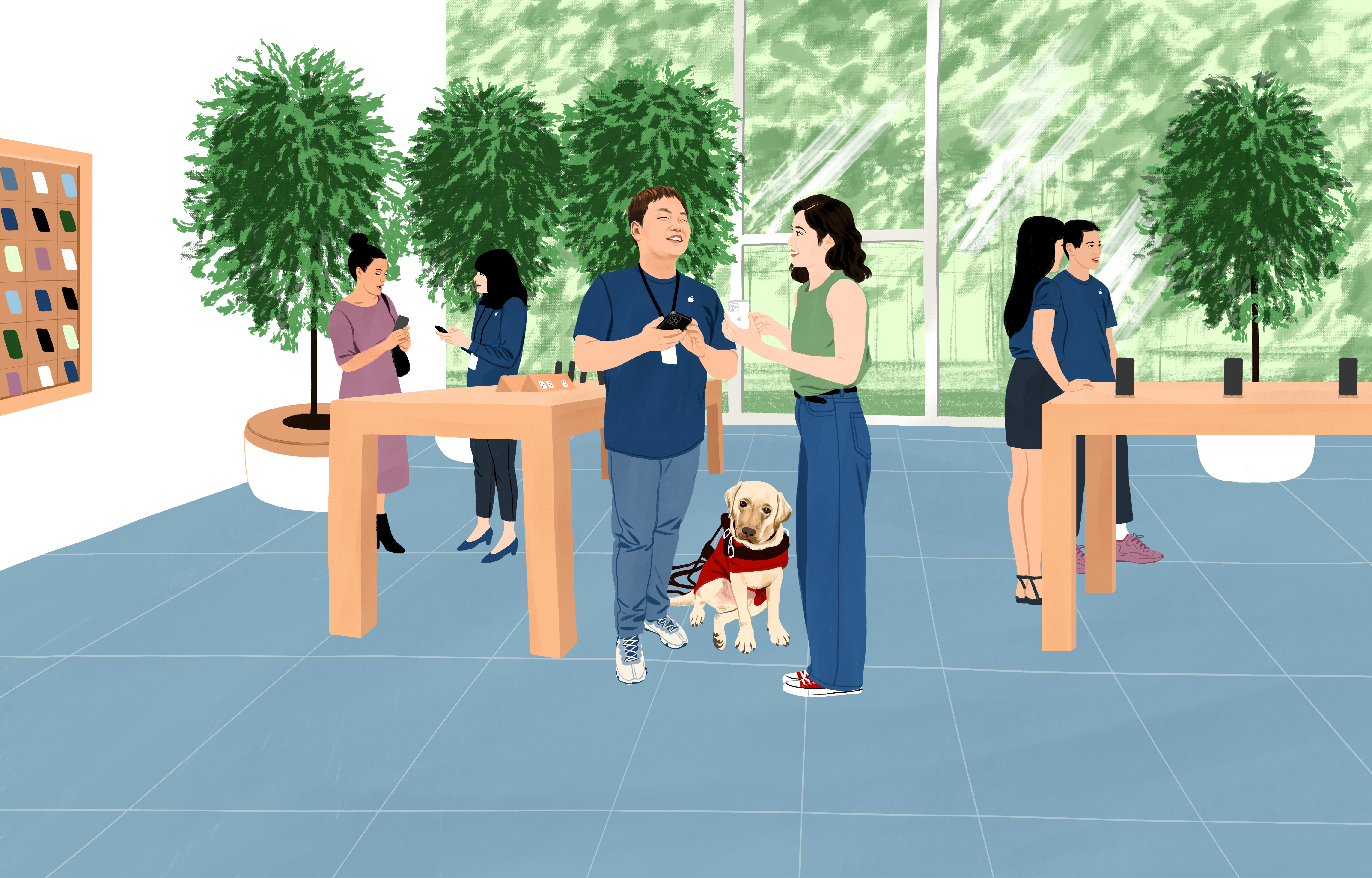 William au travail à l’Apple?Store avec son chien guide. Il tient son iPhone tandis qu’une cliente lui pose une question.