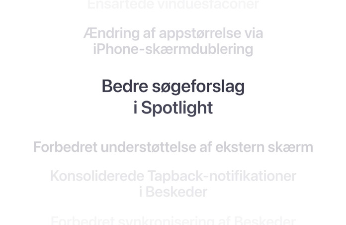 En lodret liste med funktioner, hvor “Bedre s?geforslag i Spotlight” st?r i fed skrift i midten. Omgivende funktioner l?gger sig i baggrunden ovenover og nedenunder.