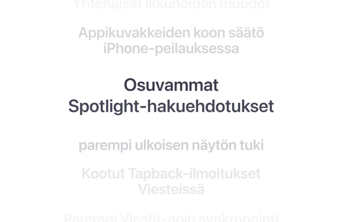 Pystysuuntainen luettelo ominaisuuksista, keskell? lihavoituna ”Better Spotlight search suggestions”. Yl?- ja alapuolella olevat ymp?r?iv?t ominaisuudet h?ivyttyv?t taustaan.