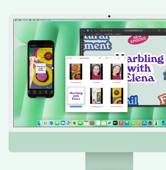 グリーンのiMac。iPhoneミラーリングが使われている。iMacから、ミラーリングされているiPhoneの畫面にファイルがドラッグされている