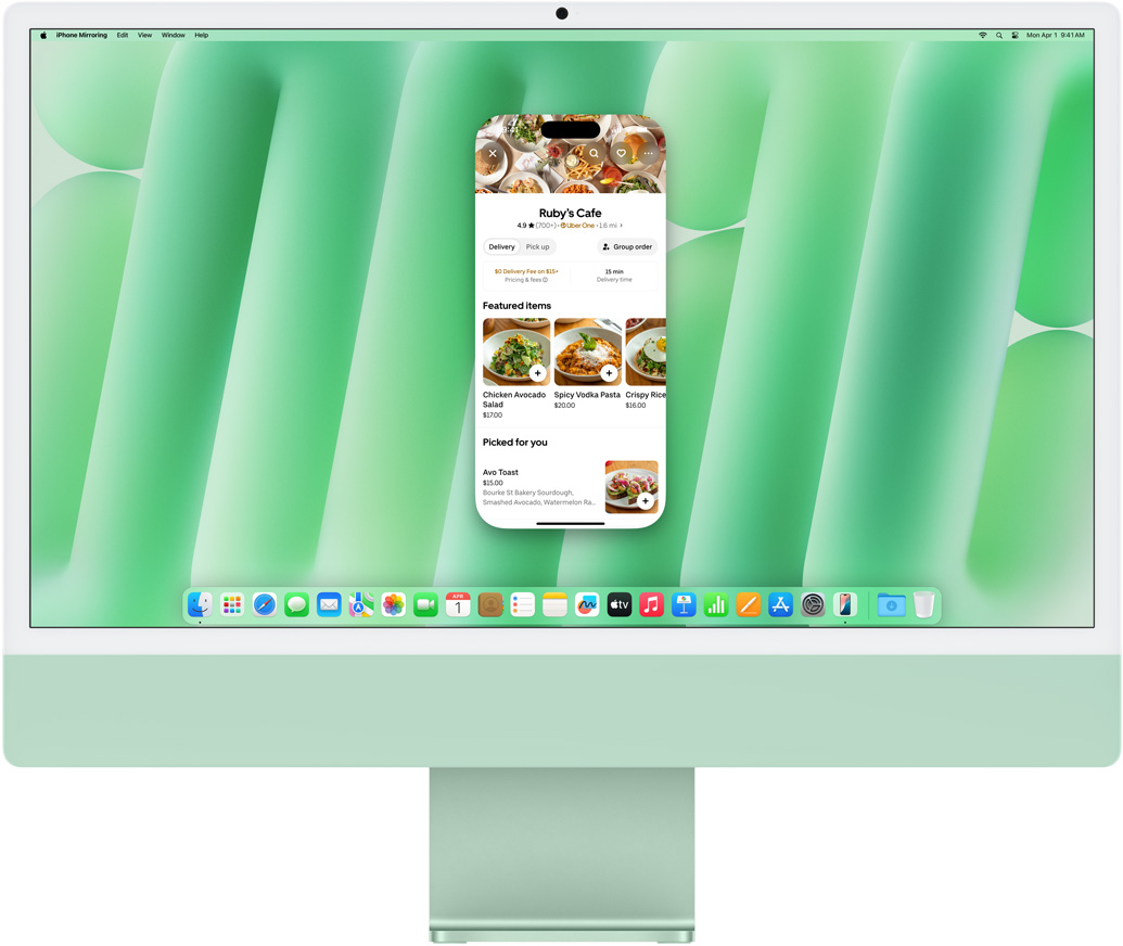 iPhone 鏡像輸出功能示範(fàn)。iPhone 螢?zāi)徽故镜?Uber Eats app 鏡像輸出至 iMac 並在 iMac 上操控。