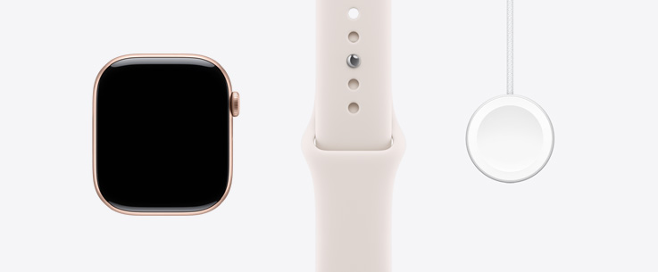 Apple Watch Series 11, hliníkové pouzdro, r??ově zlatá barva, pohled zep?edu, displej od okraje k okraji, světle ruměny sportovní ?emínek, magnetická rychlonabíje?ka Apple Watch s USB?C kabelem