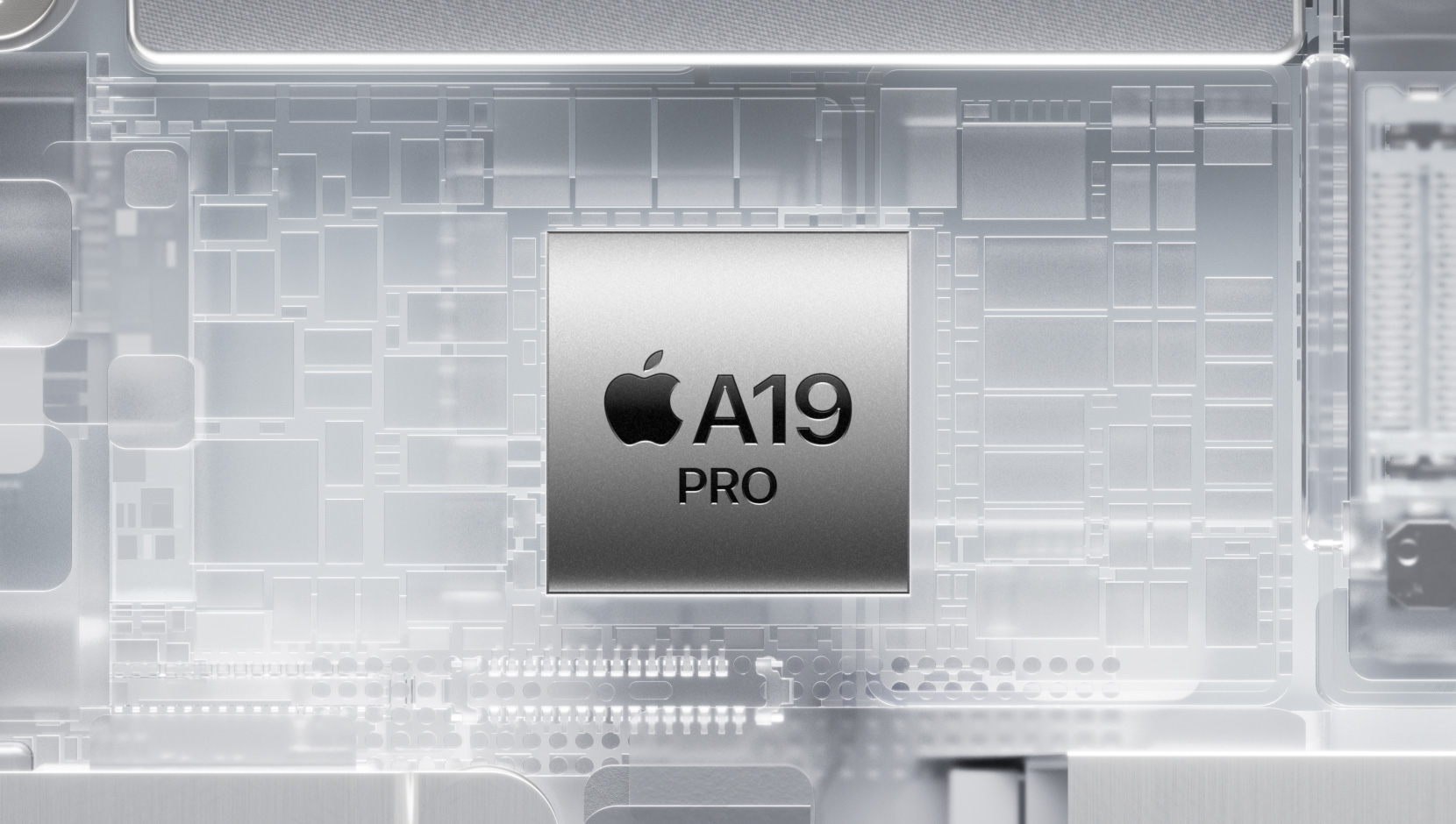 A19 Pro-chip omsluttet av komponenter som lyser p? innsiden av en iPhone