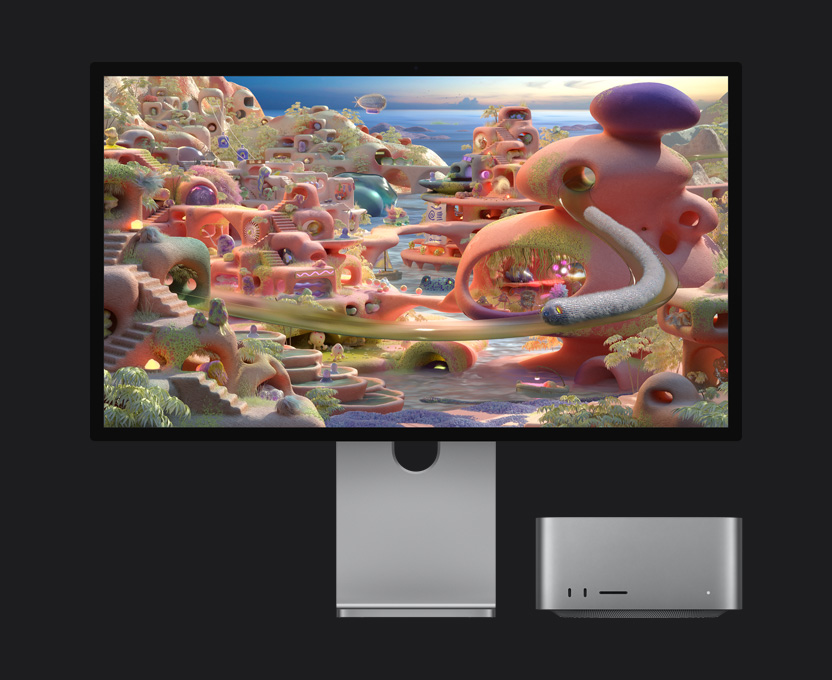 O Studio Display XDR, com o Mac Studio por baixo do monitor, apresenta uma paisagem de desenhos animados em que uma criatura tipo minhoca sai de um túnel e movimenta-se pelo ecr?
