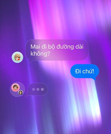 Trò chuy?n nhóm trong ?ng d?ng Tin Nh?n, ??t trên n?n tr?u t??ng màu h?ng, tím và xanh d??ng